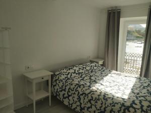 Ένα ή περισσότερα κρεβάτια σε δωμάτιο στο La Casita del Muelle