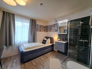 Łóżko lub łóżka w pokoju w obiekcie "Das Schlafzimmer" Erlebnis & Boutiquehotel - ehemals Hacienda Mexicana
