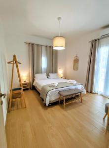 Postel nebo postele na pokoji v ubytování Villa Eftychia