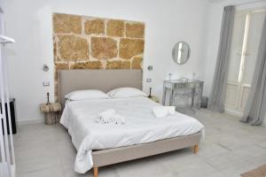 Postel nebo postele na pokoji v ubytování Yllen Rooms