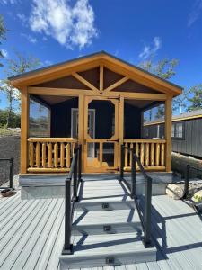 a large wooden gazebo on a deck at CARDINAL LIMIT 3 in North Sebago