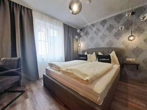 Łóżko lub łóżka w pokoju w obiekcie "Das Schlafzimmer" Erlebnis & Boutiquehotel - ehemals Hacienda Mexicana