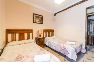Posteľ alebo postele v izbe v ubytovaní Casa Los Aperos