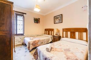 Posteľ alebo postele v izbe v ubytovaní Casa Los Aperos