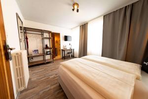 Łóżko lub łóżka w pokoju w obiekcie "Das Schlafzimmer" Erlebnis & Boutiquehotel - ehemals Hacienda Mexicana
