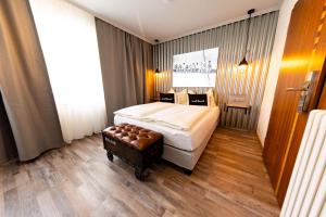 Łóżko lub łóżka w pokoju w obiekcie "Das Schlafzimmer" Erlebnis & Boutiquehotel - ehemals Hacienda Mexicana