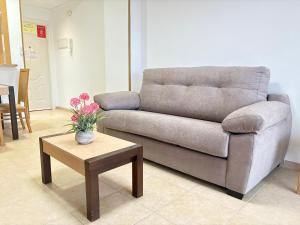 a living room with a couch and a coffee table at ACV - Torremar-2ª linea planta 3 sur 2 in El Borseral
