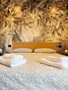 a bedroom with a bed with two pillows on it at B&B Luna Verde in Mercato San Severino