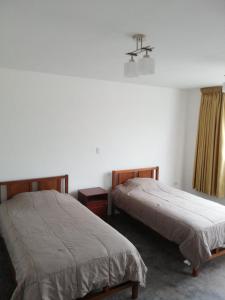 Postel nebo postele na pokoji v ubytování Casa Extremadura