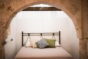 Ένα ή περισσότερα κρεβάτια σε δωμάτιο στο Trulli le Origini