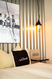 Łóżko lub łóżka w pokoju w obiekcie "Das Schlafzimmer" Erlebnis & Boutiquehotel - ehemals Hacienda Mexicana