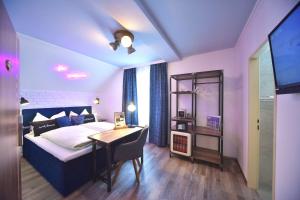 Łóżko lub łóżka w pokoju w obiekcie "Das Schlafzimmer" Erlebnis & Boutiquehotel - ehemals Hacienda Mexicana