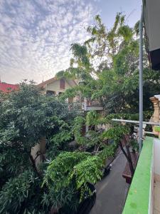 a view from a balcony of a house with trees at NamiStay Ninh Bình - Linh Đức in Ninh Binh
