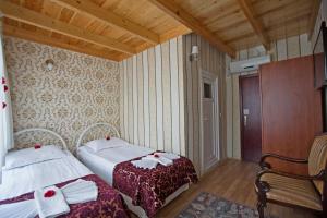 Tempat tidur dalam kamar di Sirkeci Emek Hotel