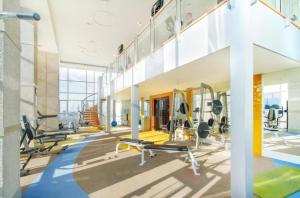 a gym with treadmills and cardio equipment in a building at 2 BR in Downtown BTS Chitlom BKK in Bangkok