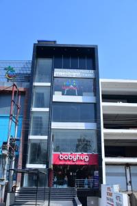 a building with a sign on the side of it at Bhoomi Palace Hotel 2 O and Bella's Bites Restaurant in Gorakhpur +8 photos