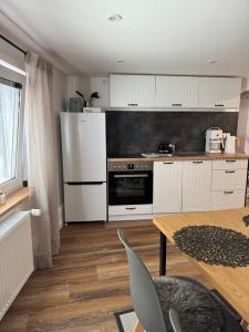 Kuchyň nebo kuchyňský kout v ubytování Stadtzauber Apartments + 36 fotografií
