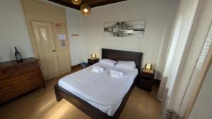 Postel nebo postele na pokoji v ubytování Rei Wamba GuestHouse