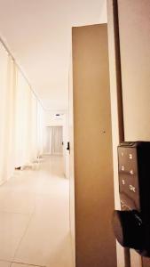 an open door to a hallway in a building at WeStay Ladies Hostel in Dubai