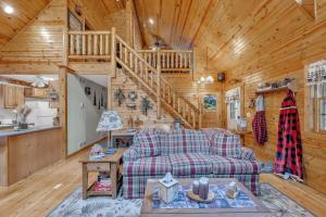 a living room with a couch and a staircase at Woodlands Cabin Retreat in Oxford cabin in Oxford