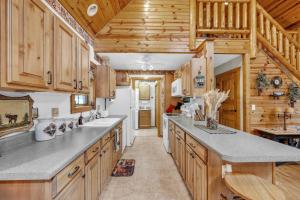 a kitchen with wooden cabinets and a white refrigerator at Woodlands Cabin Retreat in Oxford cabin in Oxford +29 photos