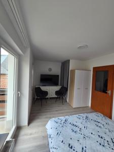 Postel nebo postele na pokoji v ubytování Apartmaji Pri Kokolu