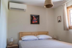 Postel nebo postele na pokoji v ubytování Limeri Apartments