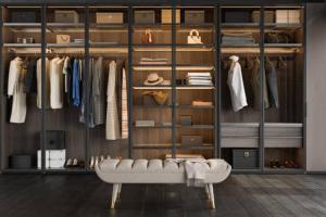 a room with a closet with a bench in it at Soul naz homes in Dar es Salaam