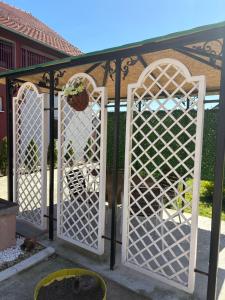 a pair of gates in a garden at Pro Arte 2 in Kladovo