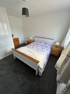 a bedroom with a bed and two night stands at 20 Fairview Chepstow in Chepstow