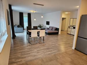 a living room and dining room with a table and chairs at Quiet Place in Achern