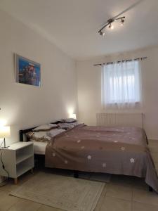 Postel nebo postele na pokoji v ubytování Kun Kuckó Vendégház