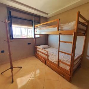 a room with two bunk beds and a window at The View in Taghazout