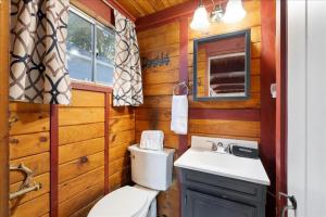 a bathroom with a toilet and a sink at Waterfront w/ Prvt Dock & Firepit | Sleeps 8 in Acton +136 photos