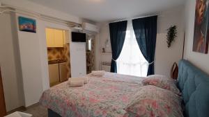 Postel nebo postele na pokoji v ubytování Apartments Gabriela