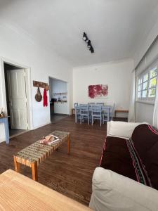 a living room with a couch and a table at Lo de Nina in Azul