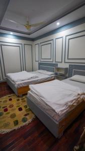 Ένα ή περισσότερα κρεβάτια σε δωμάτιο στο Hargisa In Hotel Skardu