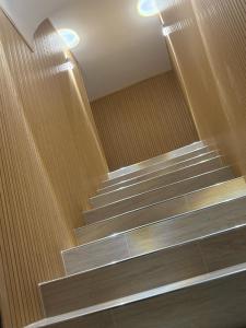 a group of stairs in a building with lights at Vikolo Apartments in Naples