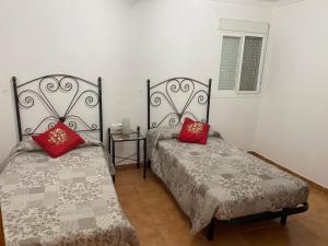 Postel nebo postele na pokoji v ubytování Granja de Iznate Apartamento