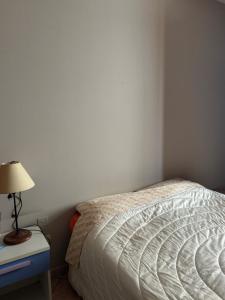 Ένα ή περισσότερα κρεβάτια σε δωμάτιο στο Giuly Apartment