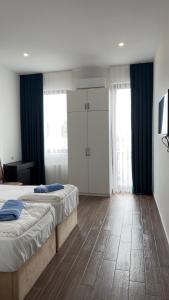 Postel nebo postele na pokoji v ubytování Star Hotel
