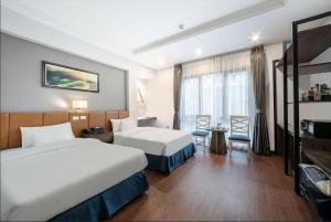 Postel nebo postele na pokoji v ubytování A25 Hotel - 193 Trung Kinh + 8 fotografií