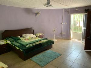 Ένα ή περισσότερα κρεβάτια σε δωμάτιο στο Auberge Kamalé
