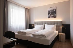 Postelja oz. postelje v sobi nastanitve Stadthotel Goldenes Schiff