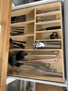 a drawer filled with lots of different types of scissors at Bauwagen Villa Sweden in Rauenberg
