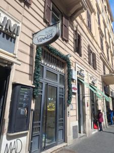 a building with a sign on the side of it at Hotel Viennese in Rome