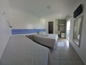 TV a/nebo společenská místnost v ubytování Hotel Ponta de Areia