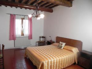 A bed or beds in a room at Agriturismo Poderi Minori
