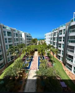 an aerial view of a resort with palm trees and buildings at Cobertura 435 - In mare bali in Parnamirim