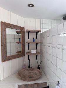 a bathroom with a mirror and a sink at Beautiful entire house in the center in Medemblik +16 photos